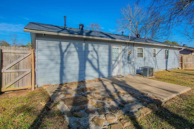 back of house featuring central AC unit and a patio area