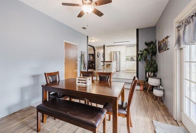 dining room with ceiling fan and a healthy amount of sunlight