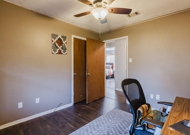 office with ceiling fan and dark hardwood / wood-style flooring