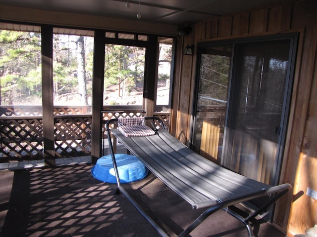 unfurnished sunroom featuring plenty of natural light