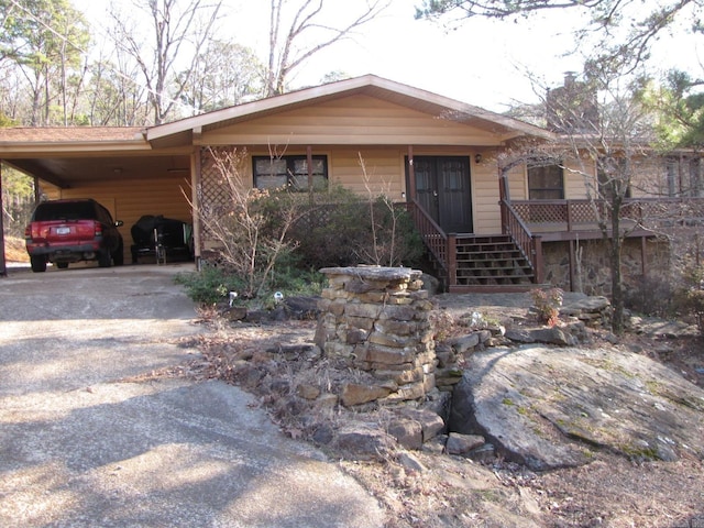 ranch-style house featuring a carport