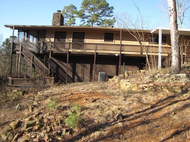 rear view of property featuring central AC unit