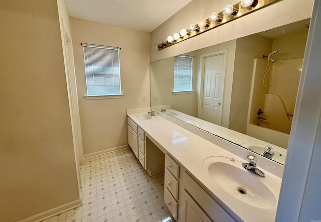 bathroom featuring vanity and bathing tub / shower combination