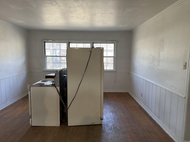 interior space with a healthy amount of sunlight, dark hardwood / wood-style flooring, and washer / clothes dryer