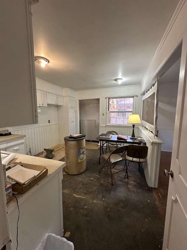 kitchen featuring ornamental molding and white cabinets