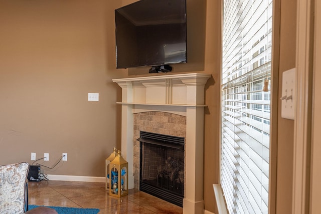 living room featuring a tile fireplace