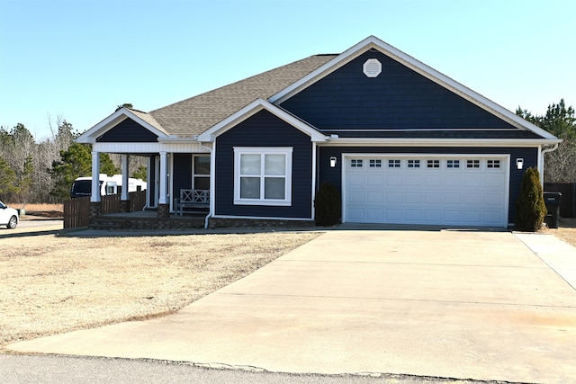 view of front of house with a garage and covered porch