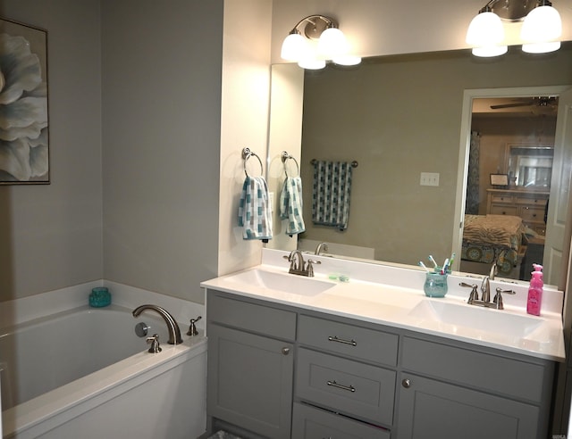 bathroom with vanity and a bathing tub