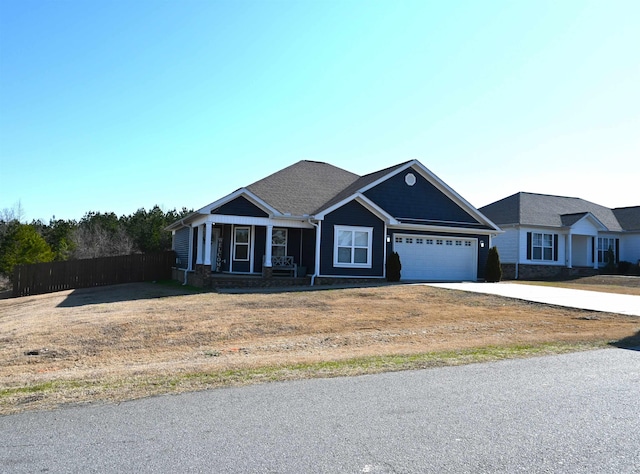 view of front of property with a garage and covered porch