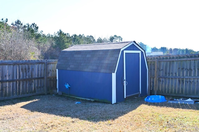 view of outdoor structure featuring a lawn