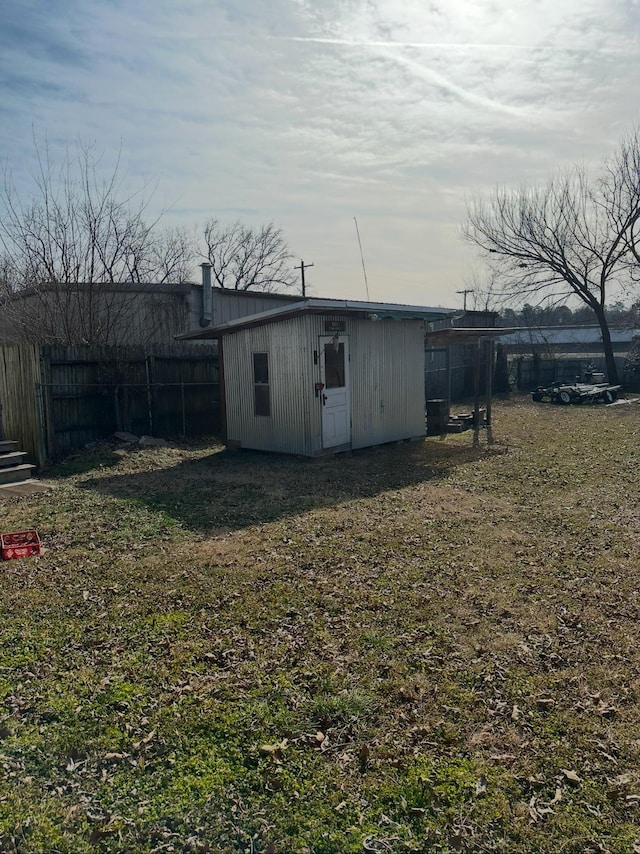 exterior space with an outbuilding and a yard