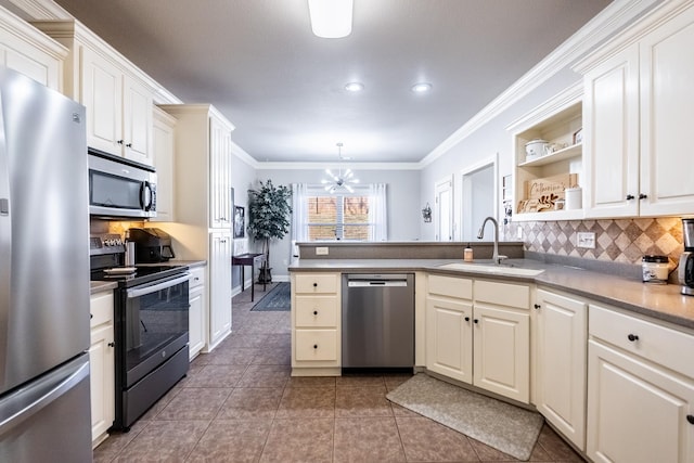 kitchen with sink, tasteful backsplash, ornamental molding, appliances with stainless steel finishes, and kitchen peninsula