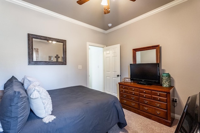 bedroom with ornamental molding, ceiling fan, and carpet flooring