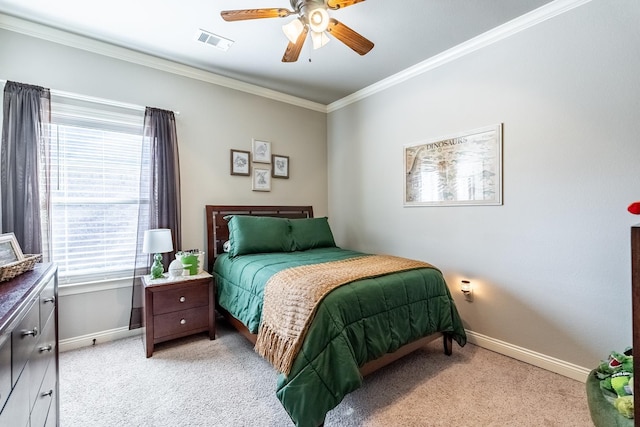 carpeted bedroom featuring ornamental molding and ceiling fan