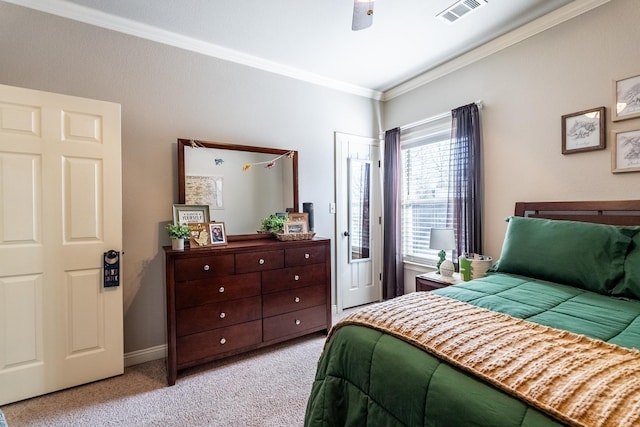 carpeted bedroom with crown molding and ceiling fan