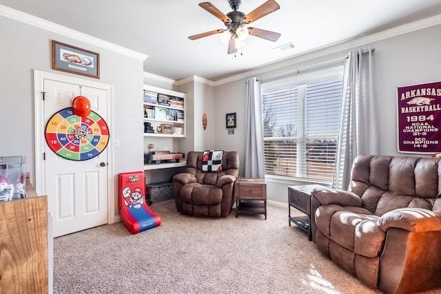 rec room featuring crown molding, ceiling fan, and carpet floors