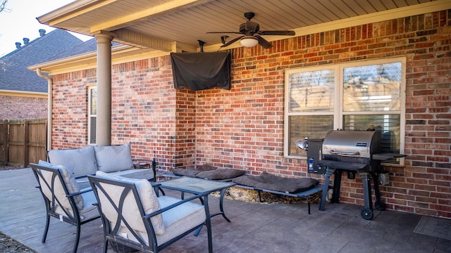 view of patio with outdoor lounge area, area for grilling, and ceiling fan