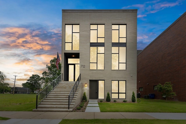 contemporary home featuring a yard