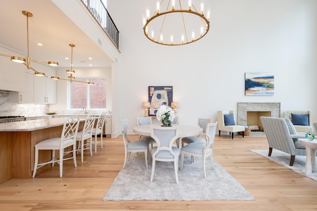 dining space featuring a chandelier and light hardwood / wood-style floors