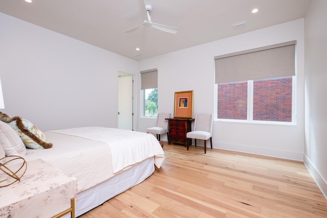 bedroom featuring light hardwood / wood-style flooring and ceiling fan