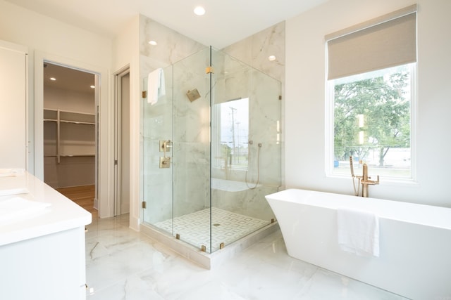 bathroom with plus walk in shower and vanity