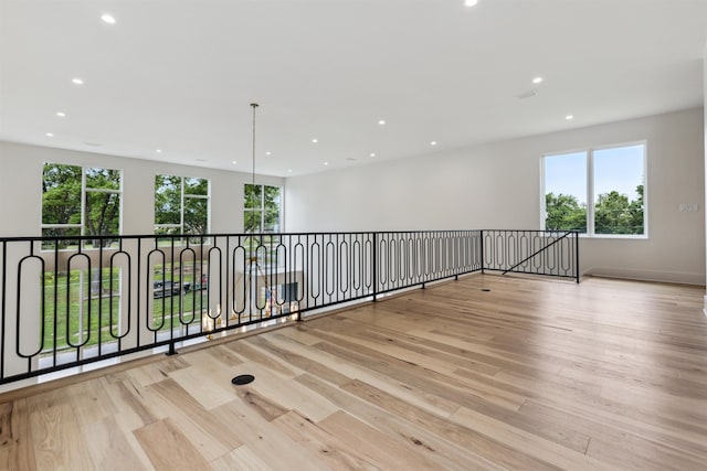 spare room featuring plenty of natural light and light wood-type flooring