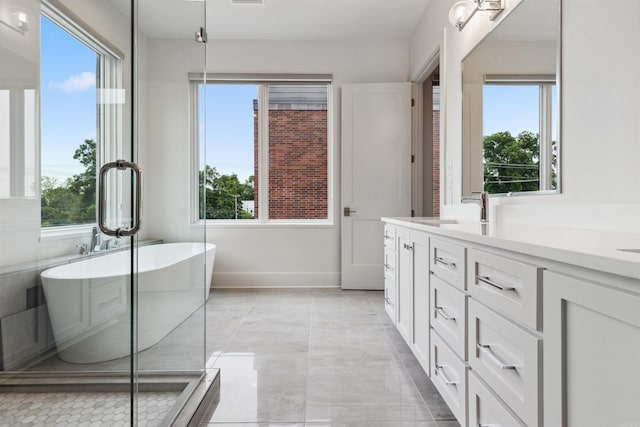 bathroom with vanity and a bathtub