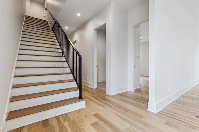 stairway featuring hardwood / wood-style floors