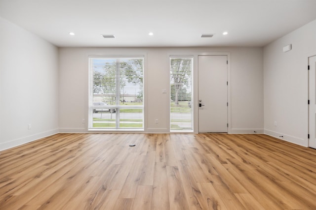 spare room with light wood-type flooring