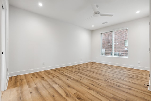 unfurnished room with ceiling fan and light hardwood / wood-style floors