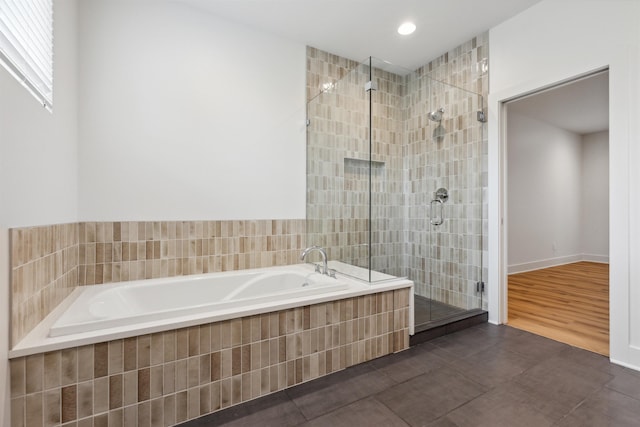 bathroom with plus walk in shower and tile patterned flooring