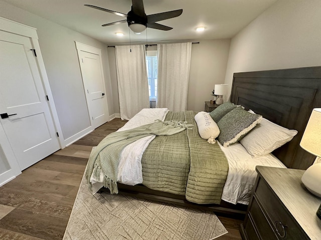 bedroom featuring dark wood-type flooring and ceiling fan