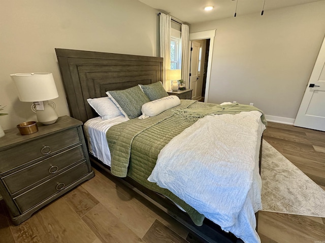 bedroom featuring hardwood / wood-style flooring