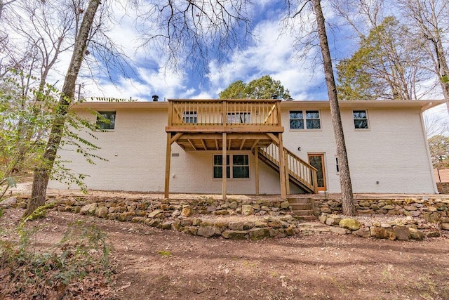 rear view of house featuring a deck