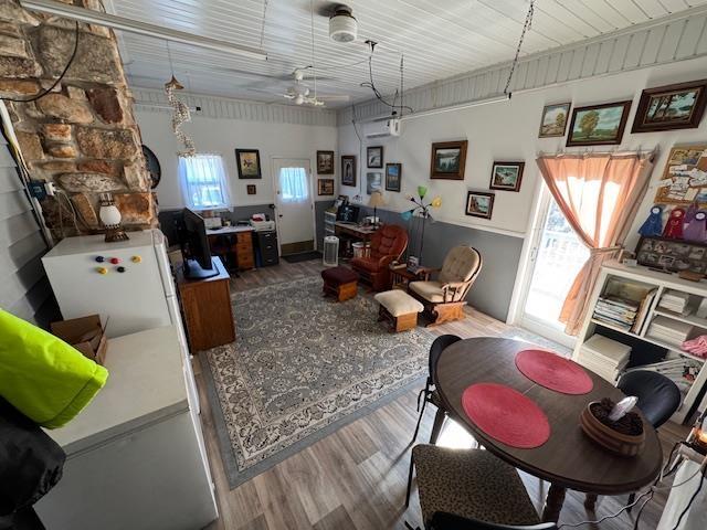 interior space with a wealth of natural light and wood-type flooring