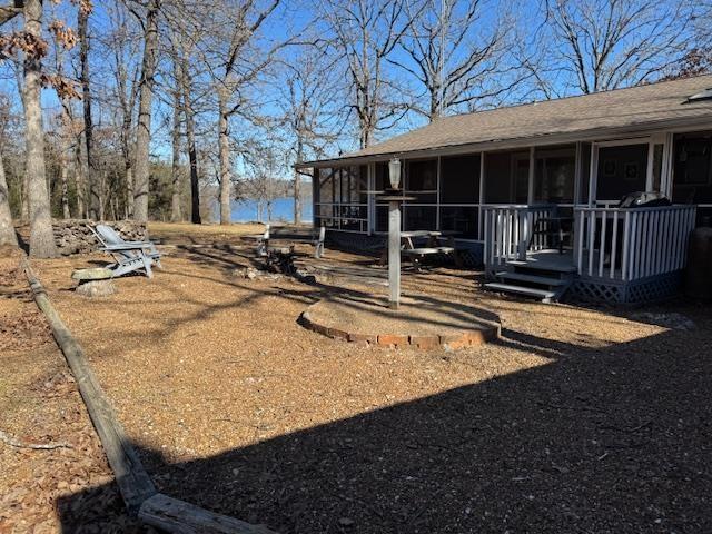 view of yard featuring a sunroom