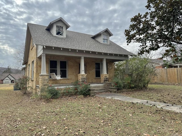 view of front of house featuring a front lawn and a porch