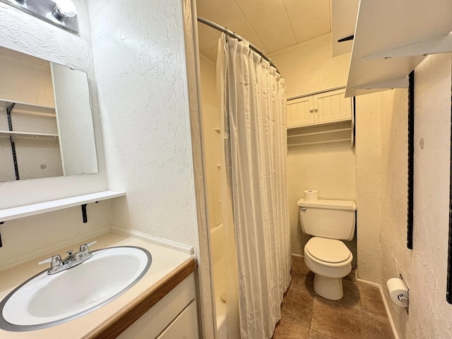 bathroom with walk in shower, vanity, and toilet