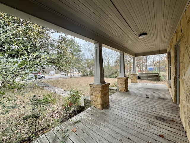 wooden deck featuring covered porch