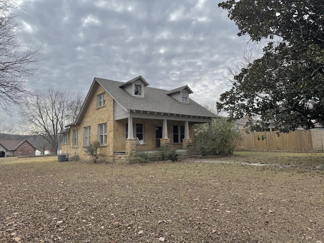 view of front of home with central air condition unit and a porch