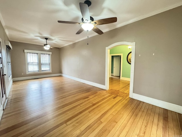 unfurnished room featuring ornamental molding, light hardwood / wood-style floors, and ceiling fan