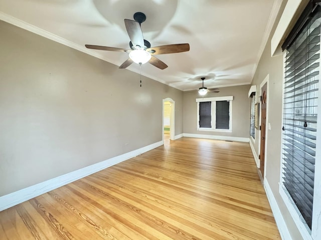 spare room with crown molding, ceiling fan, and light hardwood / wood-style floors