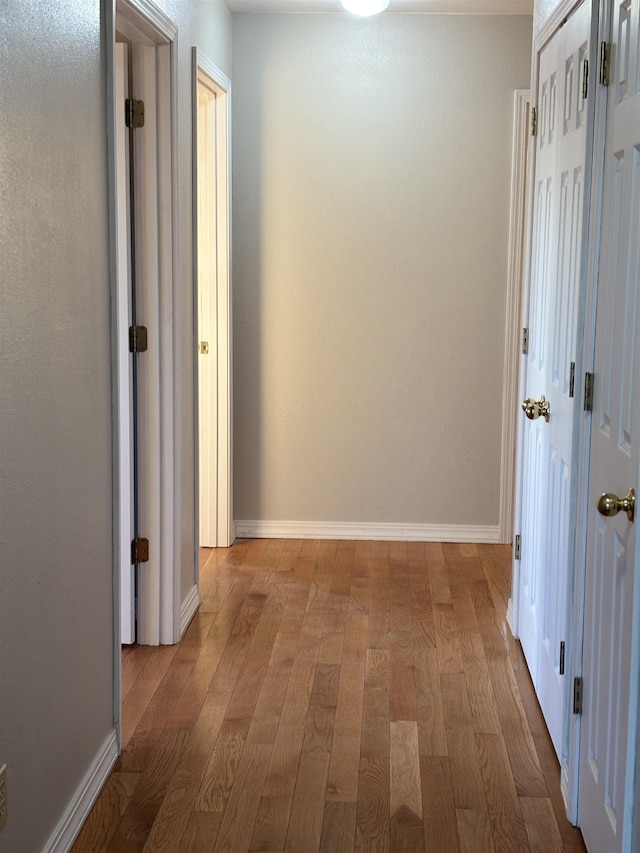 corridor featuring light wood-type flooring