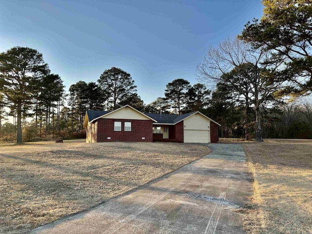 single story home featuring a garage