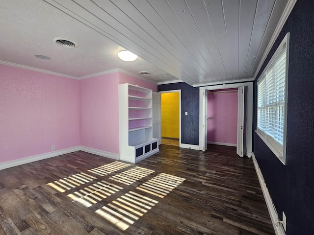 unfurnished bedroom with crown molding, dark hardwood / wood-style floors, and wood ceiling