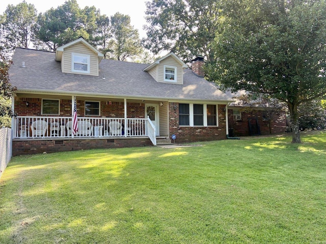 cape cod-style house featuring covered porch and a front lawn