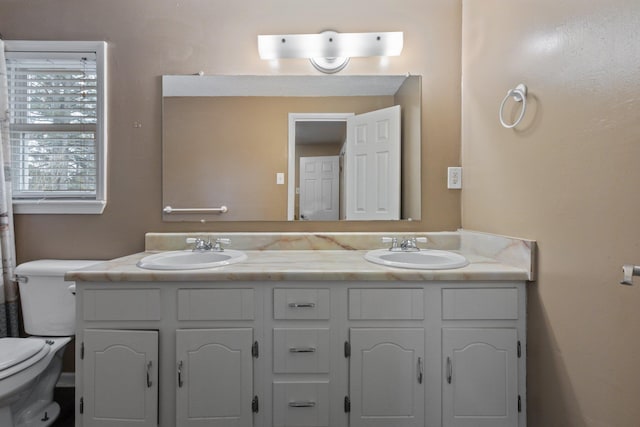 bathroom with vanity and toilet