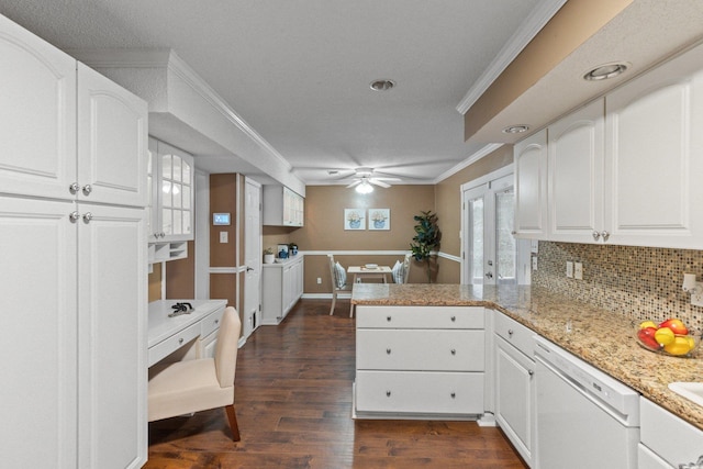 kitchen with dark hardwood / wood-style flooring, white dishwasher, kitchen peninsula, decorative backsplash, and white cabinets