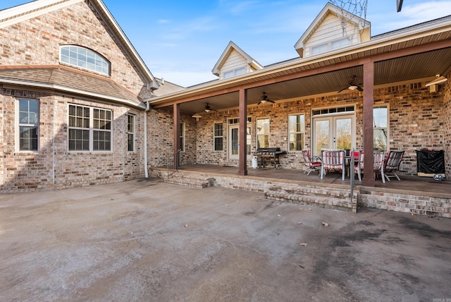 view of patio with french doors and ceiling fan