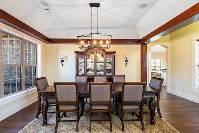 dining room featuring dark hardwood / wood-style flooring and a notable chandelier